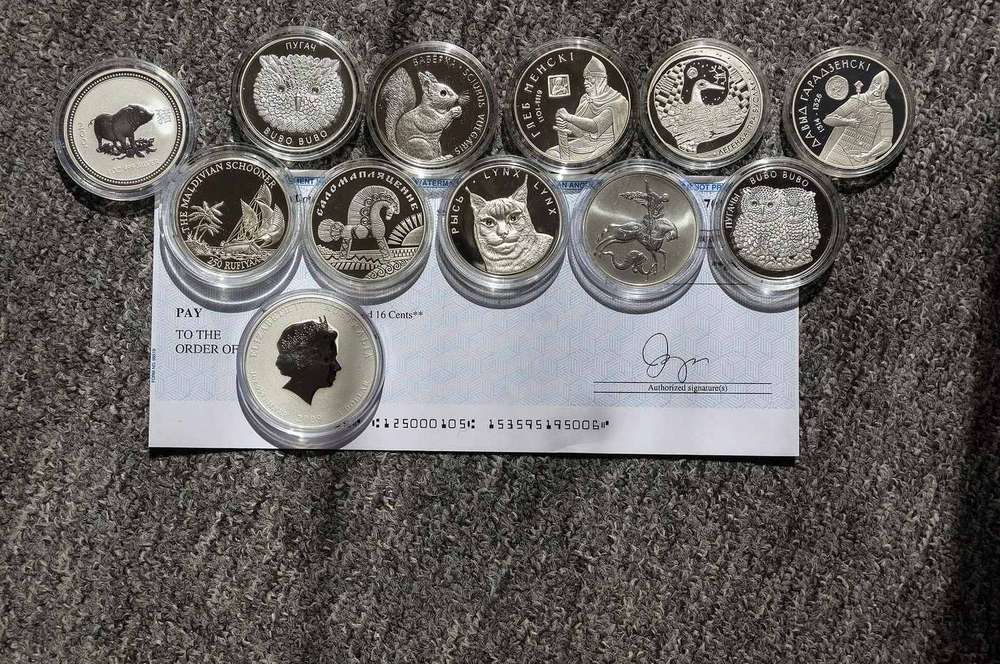 A collection of silver coins laid out